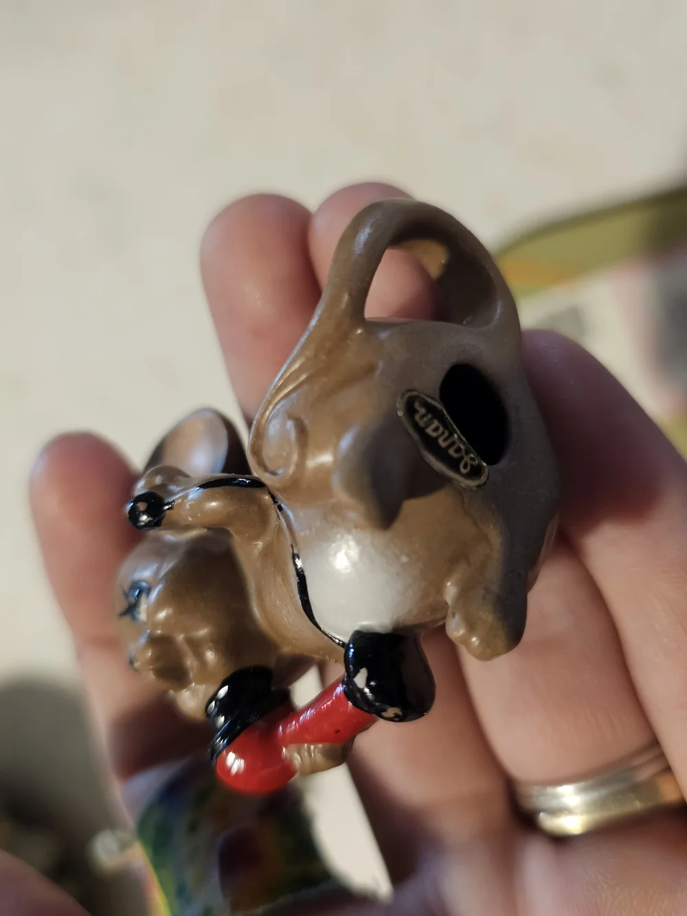 Brown Ceramic Mouse Figurine with Red Phone Decorative Accent